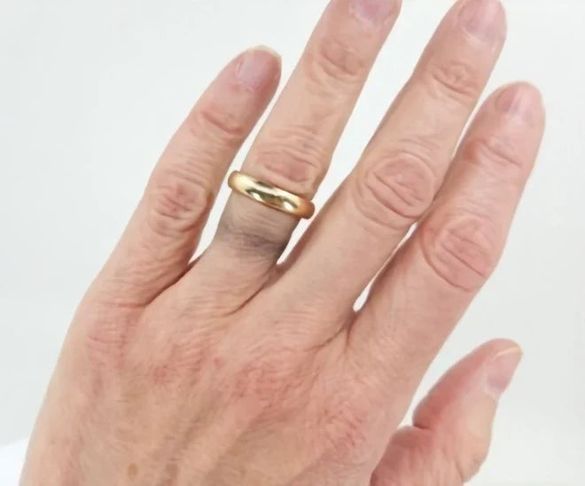 Why is my gold jewelry discoloring my skin?