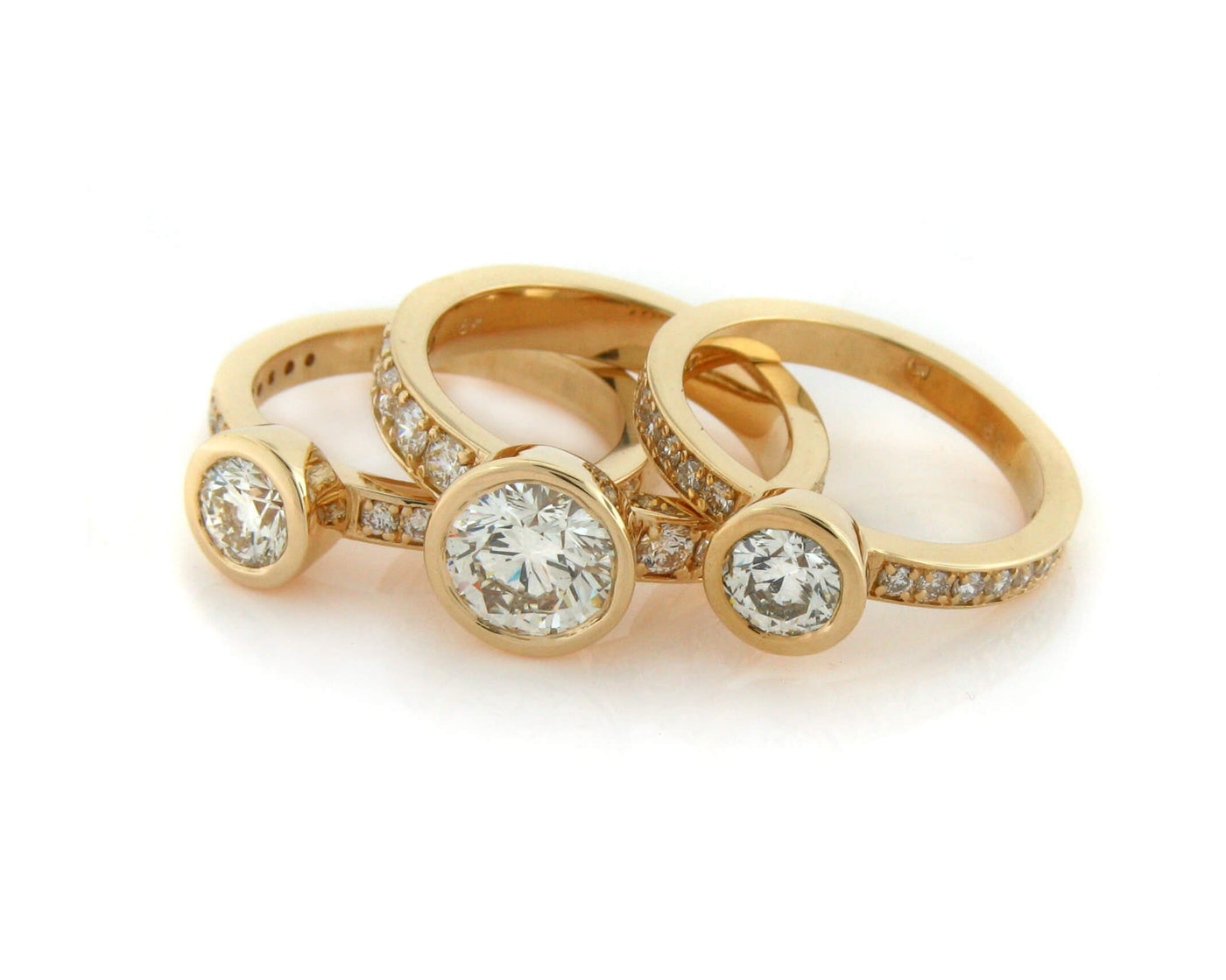 Stacking rings remade from an inherited bridal set and diamond studs