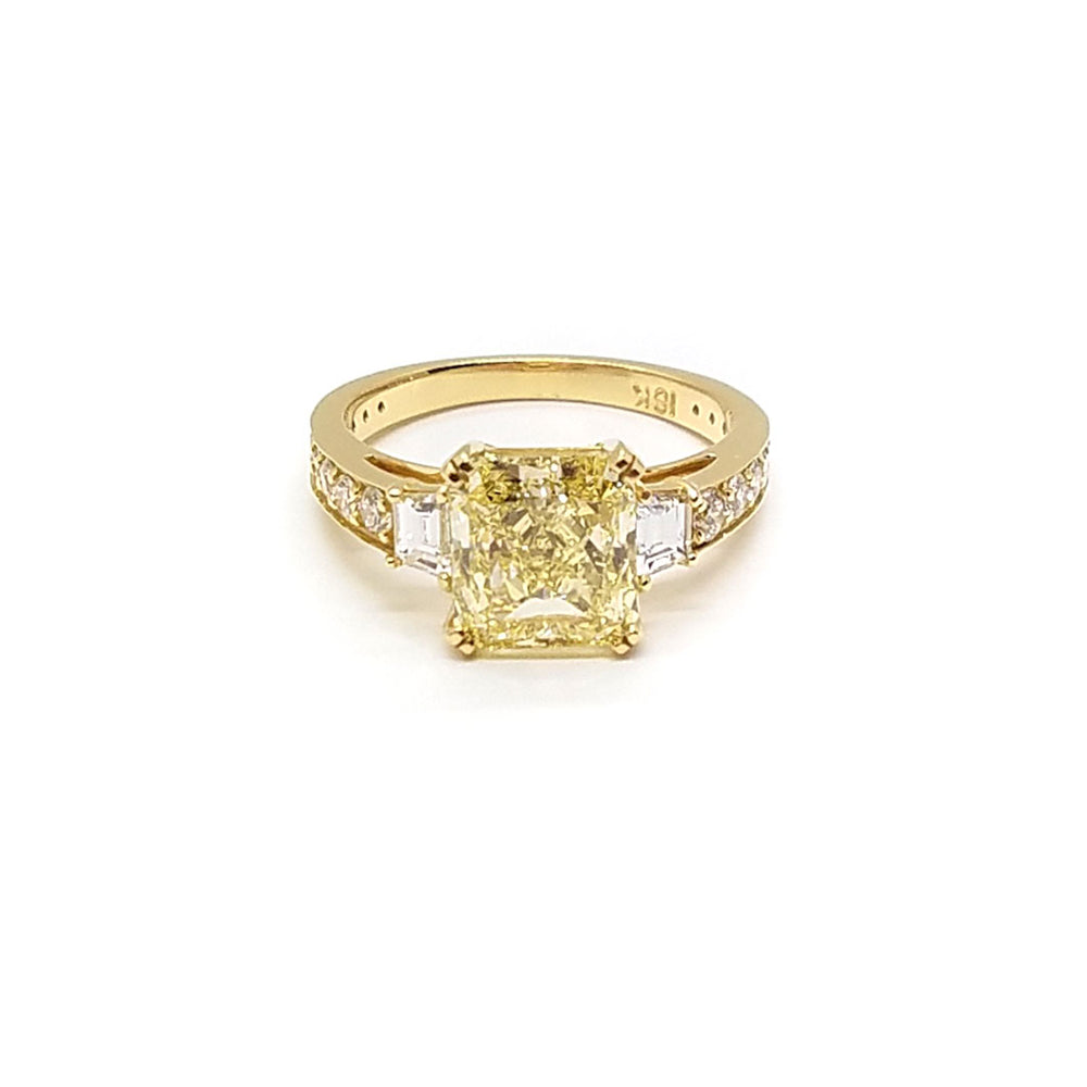 Radiant cut Yellow diamond 3-stone ring with Trapezoid diamonds
