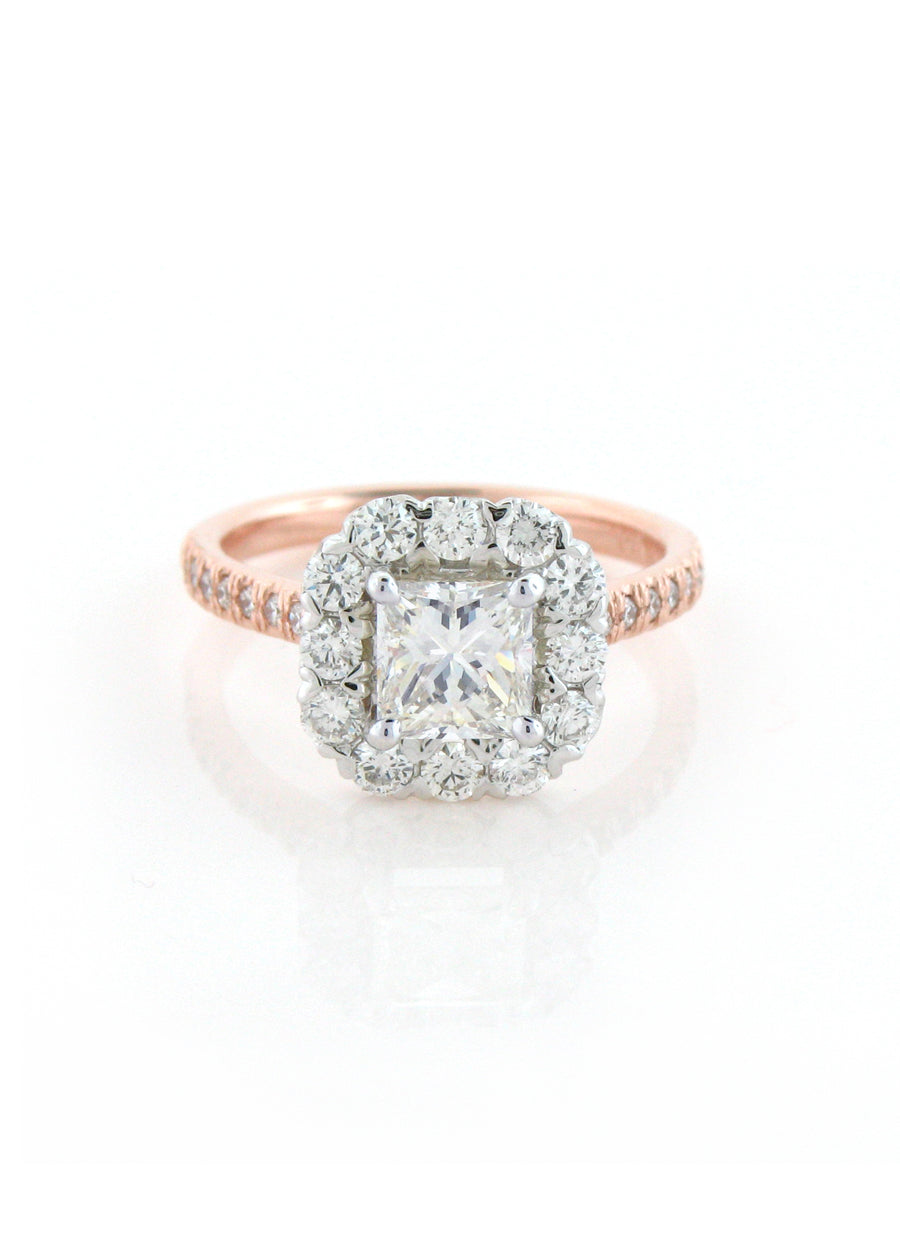 Two-tone rose gold and platinum engagement ring with a princess cut diamond in a halo, made for a client