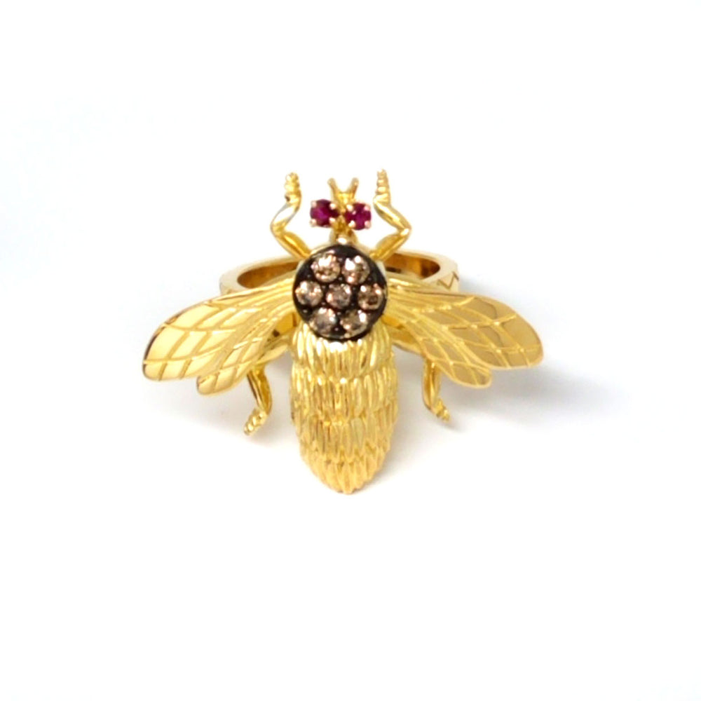 A Bumble bee ring with ruby eyes and chocolate diamonds