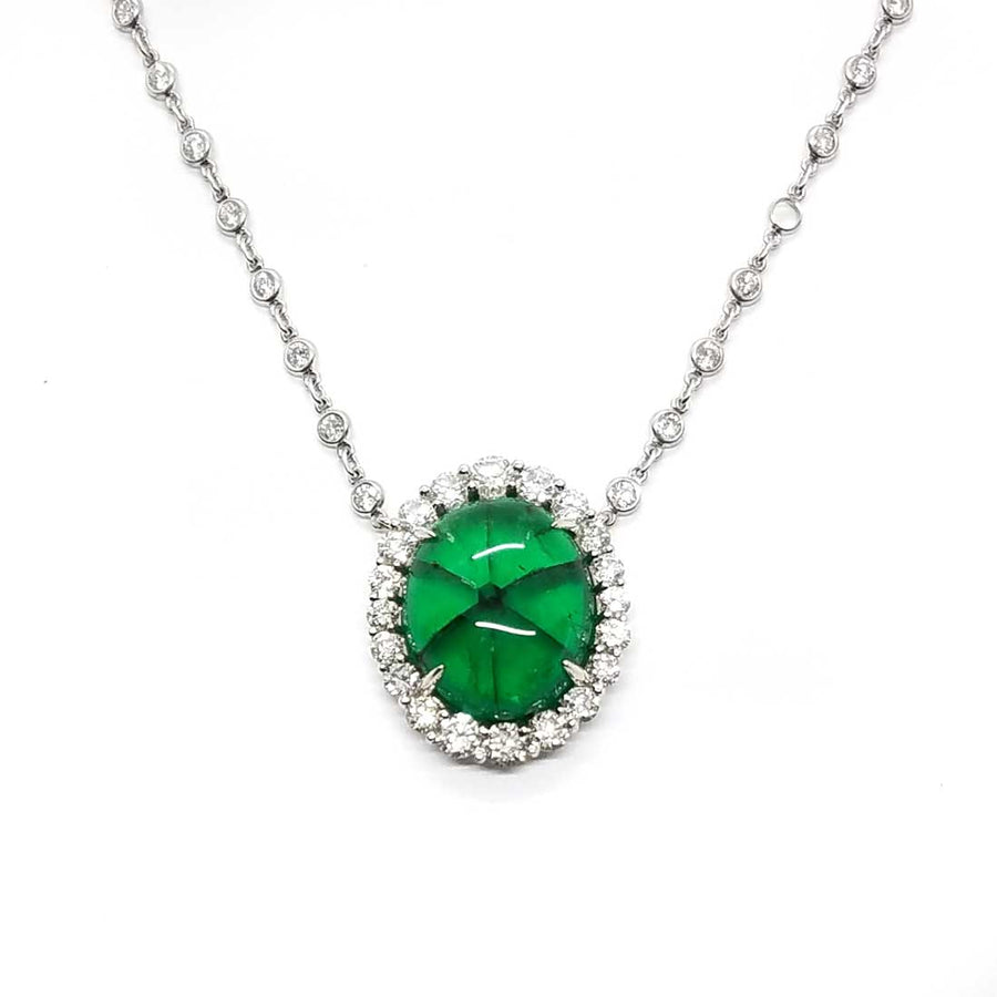 A rare Trapiche Emerald with a diamond halo and diamond chain