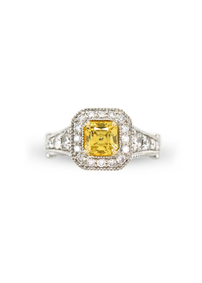 A square radiant cut yellow diamond surrounded by white diamonds with a graduated diamond shank, made for a client