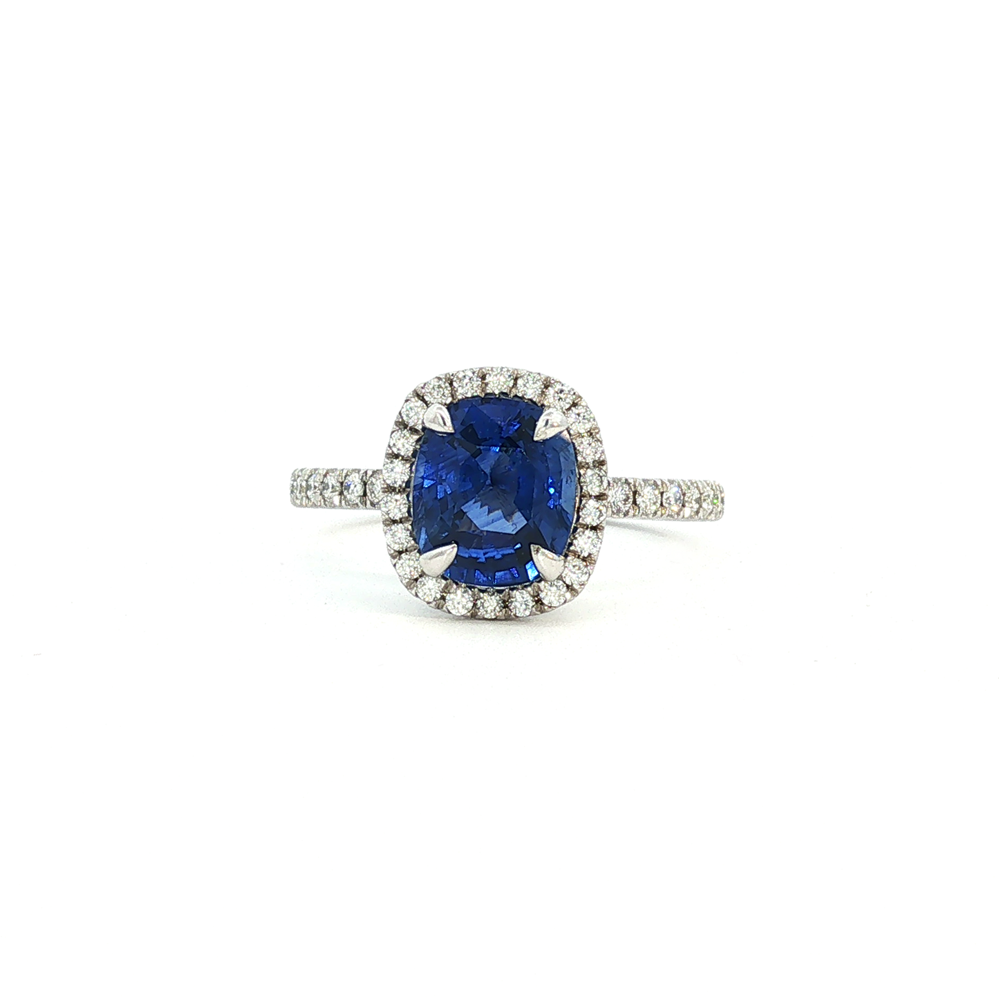 Royal Blue Sapphire and Diamond Halo Ring in White Gold